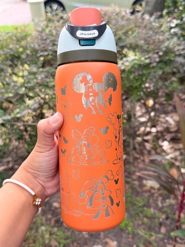 Orange Owala FreeSip laser engraved with a Goofy-inspired design
