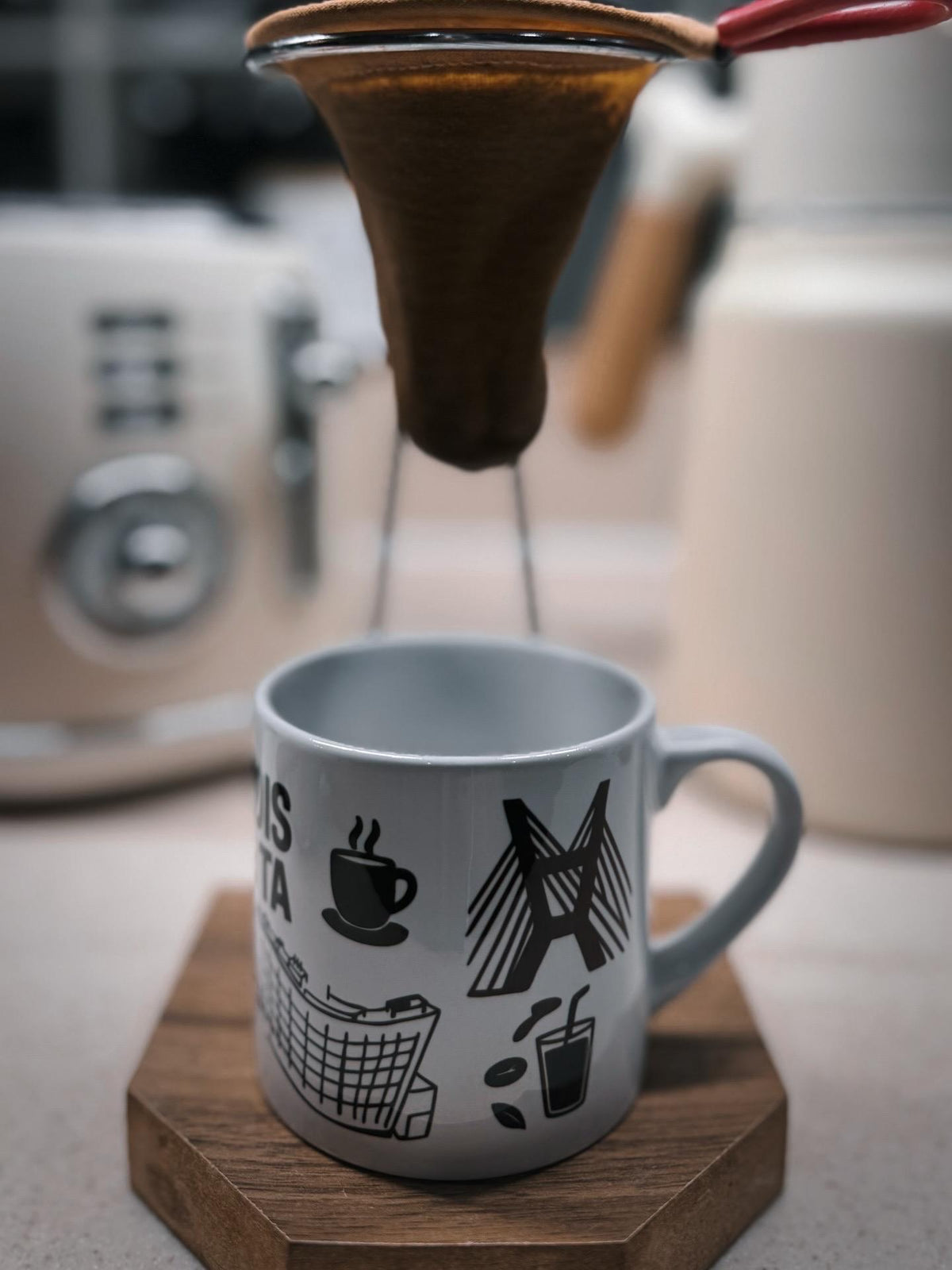 São Paulo-themed ceramic espresso mug under a coffee machine