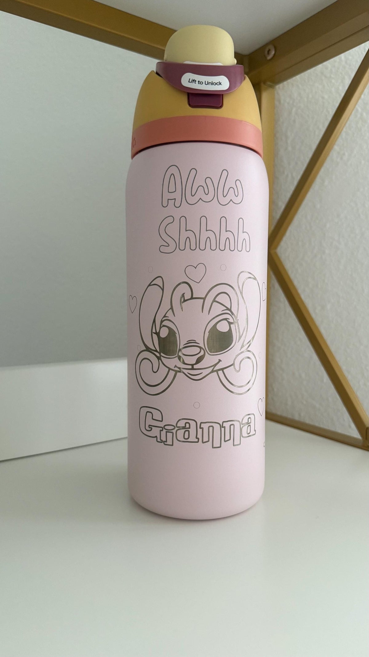 Close-up of Angel-inspired engraving and name on a pink Owala