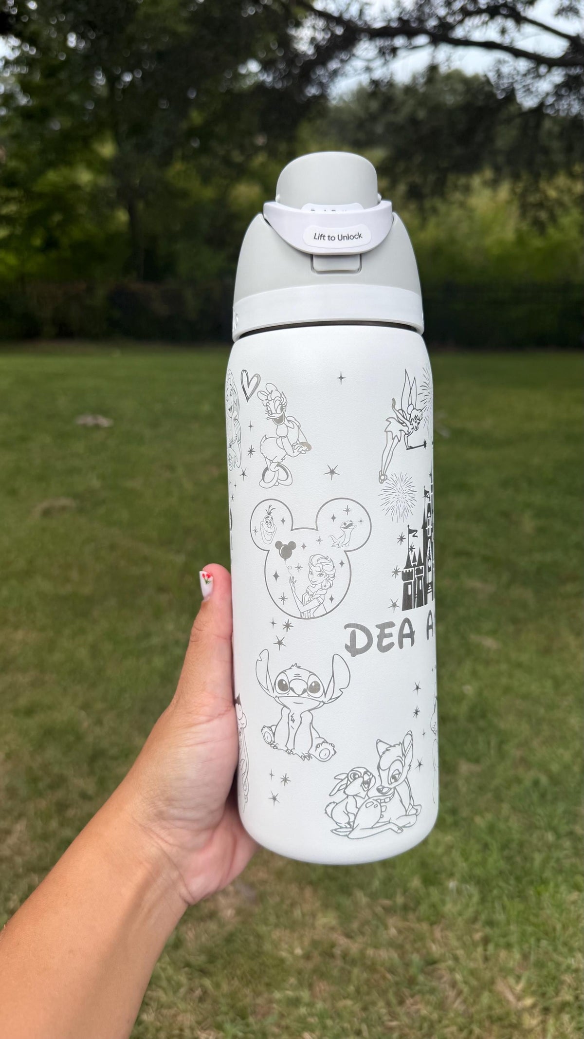 Close-up of Disney-inspired character engraving on a white Owala