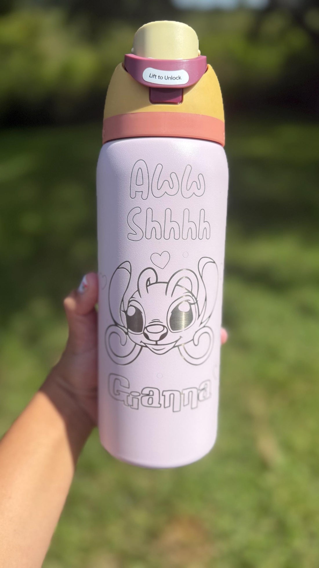Light pink Owala FreeSip laser engraved with an Angel-inspired design and a name