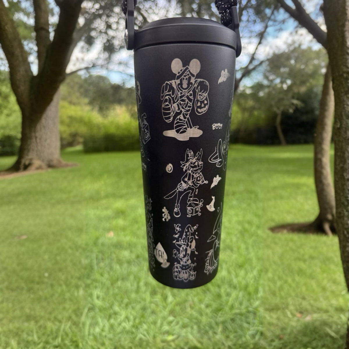 Close-up of the Halloween design on a black insulated tumbler
