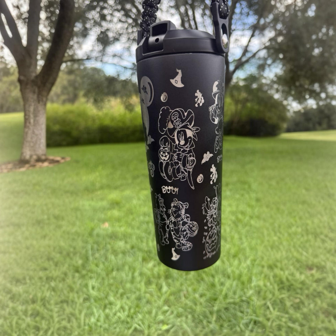 Black 24 oz tumbler with a scary Mickey-inspired Halloween design