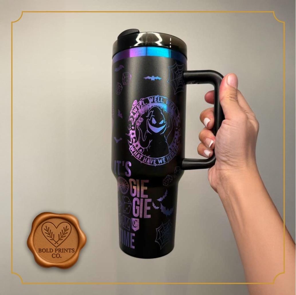Black 40 oz tumbler with handle, laser engraved with an Oogie Boogie-inspired Halloween design