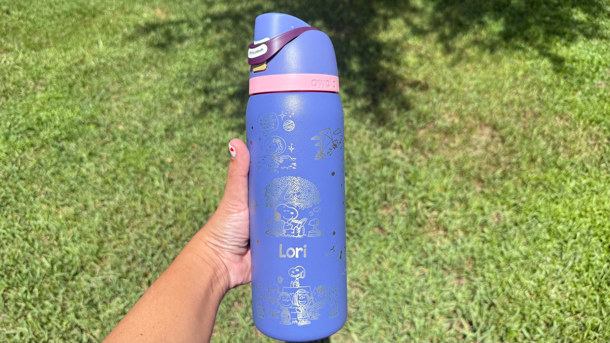 Periwinkle Owala FreeSip with pink lid, engraved with Snoopy and a name