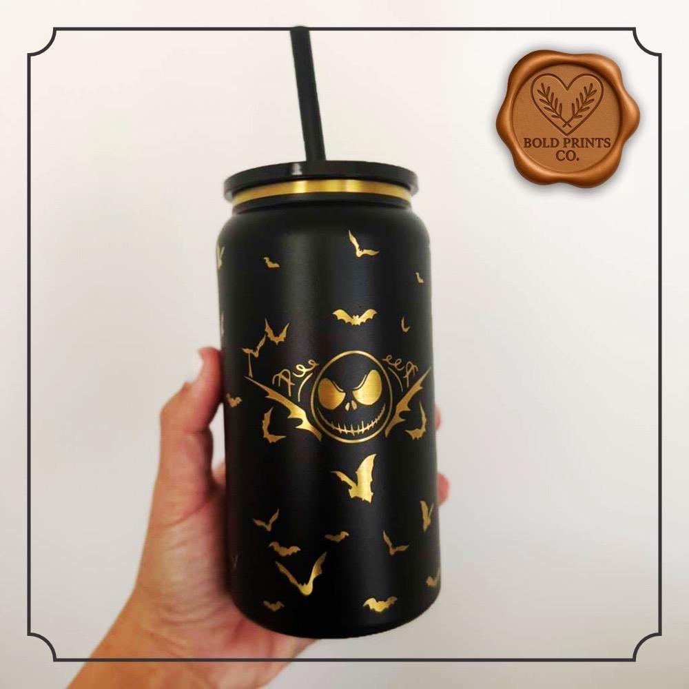Side view of a black gothic Halloween tumbler with engraved details