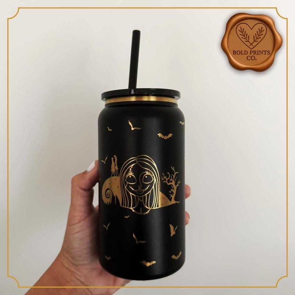 Jack and Sally-inspired engraved tumbler held against a white background