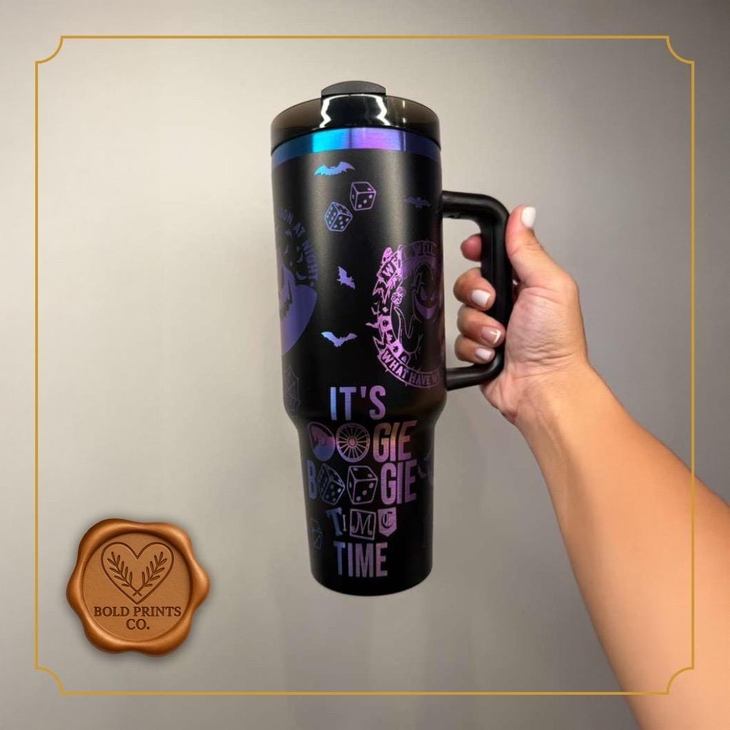 Front of a black 40 oz Halloween tumbler with iridescent engraved lettering