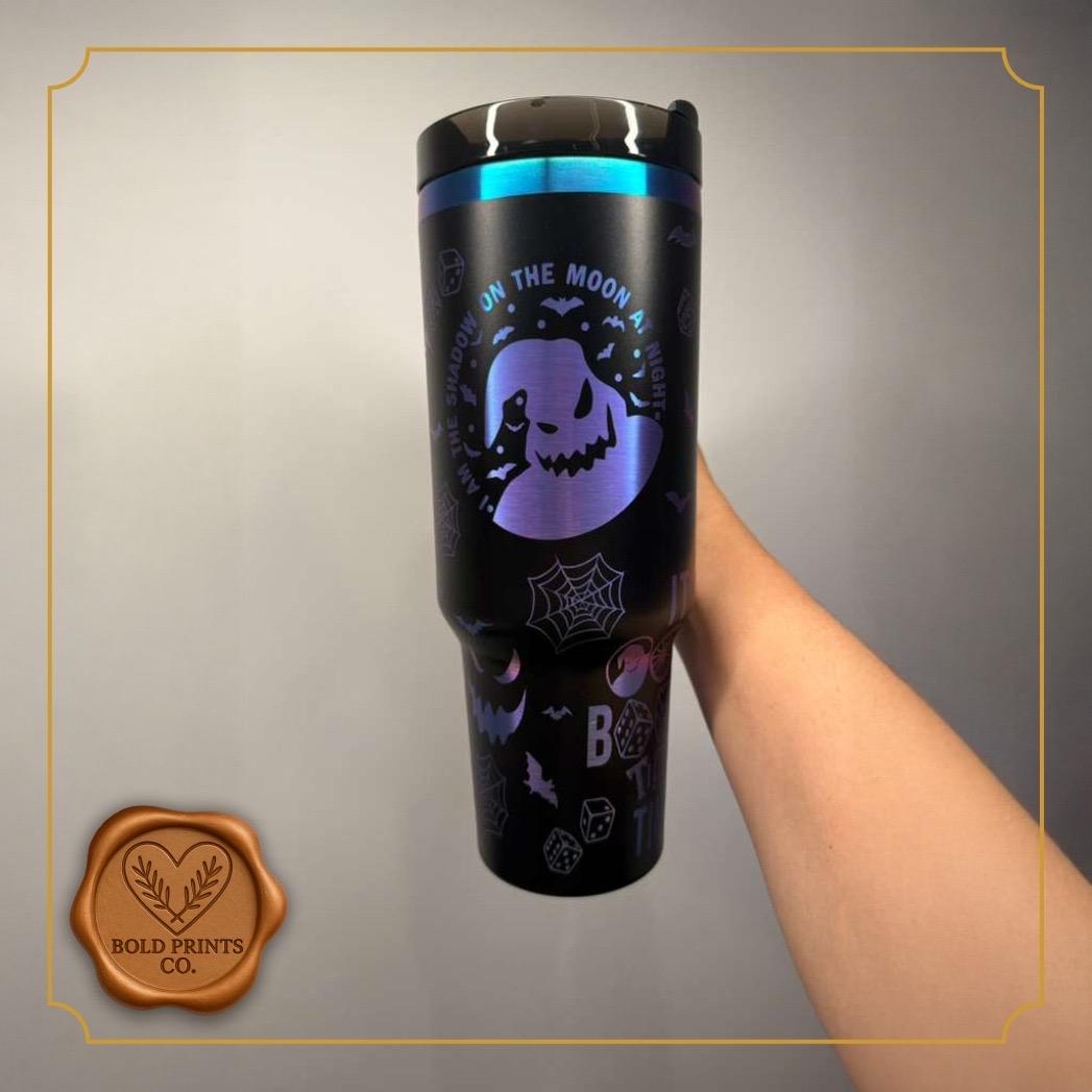 Close-up of the engraved Halloween design on a black tumbler