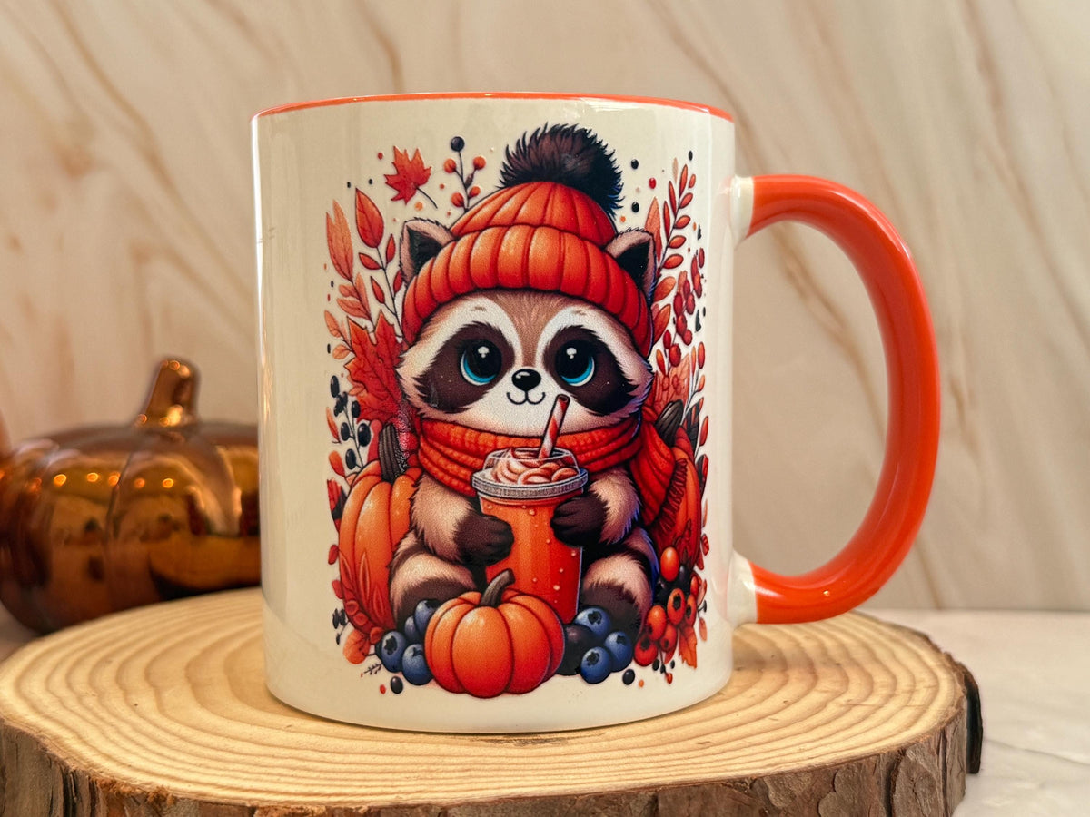 Autumn raccoon coffee mug on a wood slice