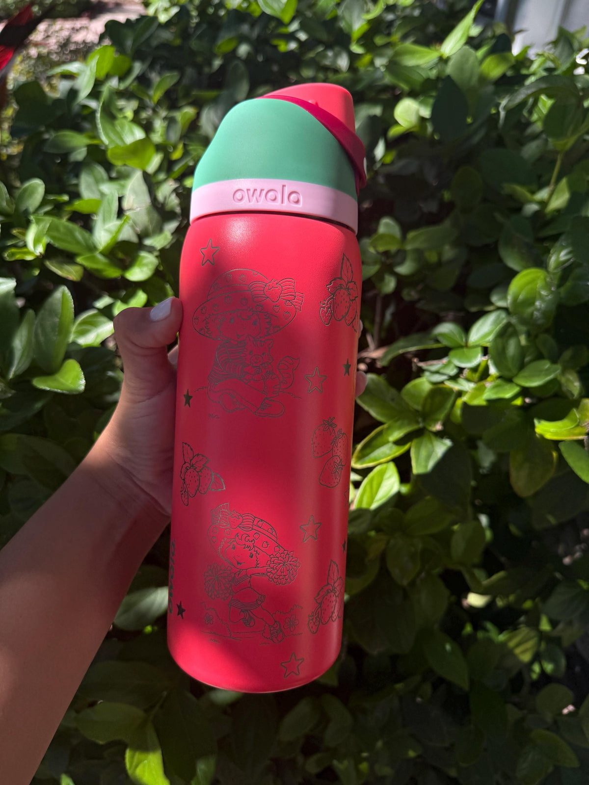 Back of a pink strawberry Owala FreeSip