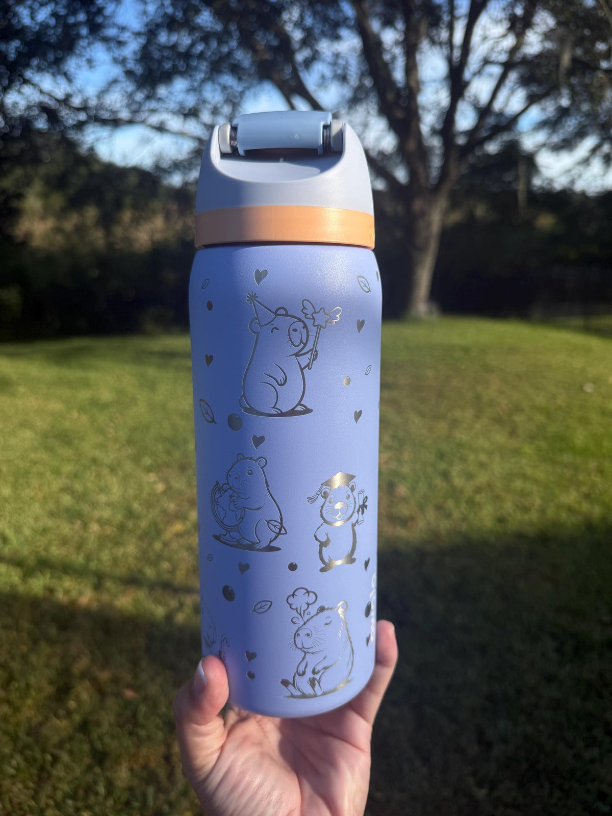 Close-up of a capybara engraving on a periwinkle Owala