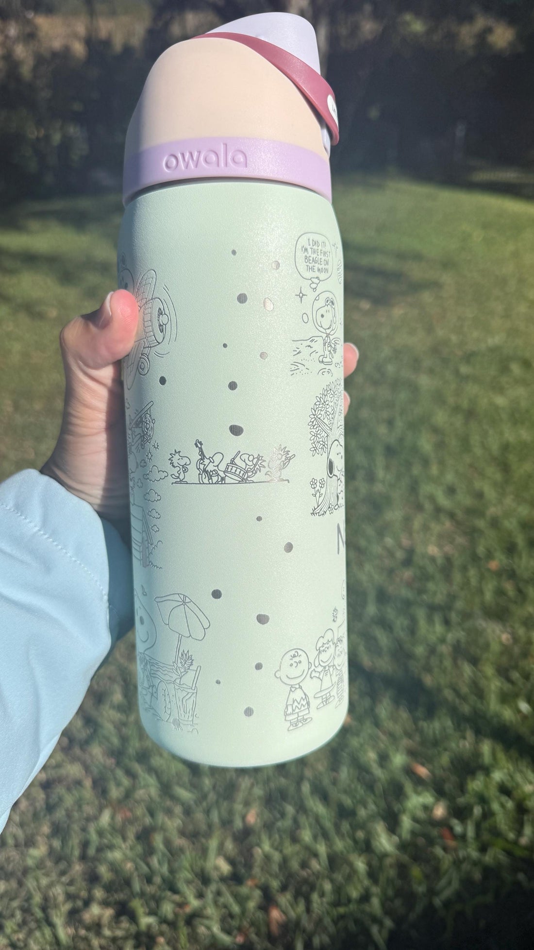 Mint green Owala FreeSip laser engraved with Snoopy and Peanuts characters