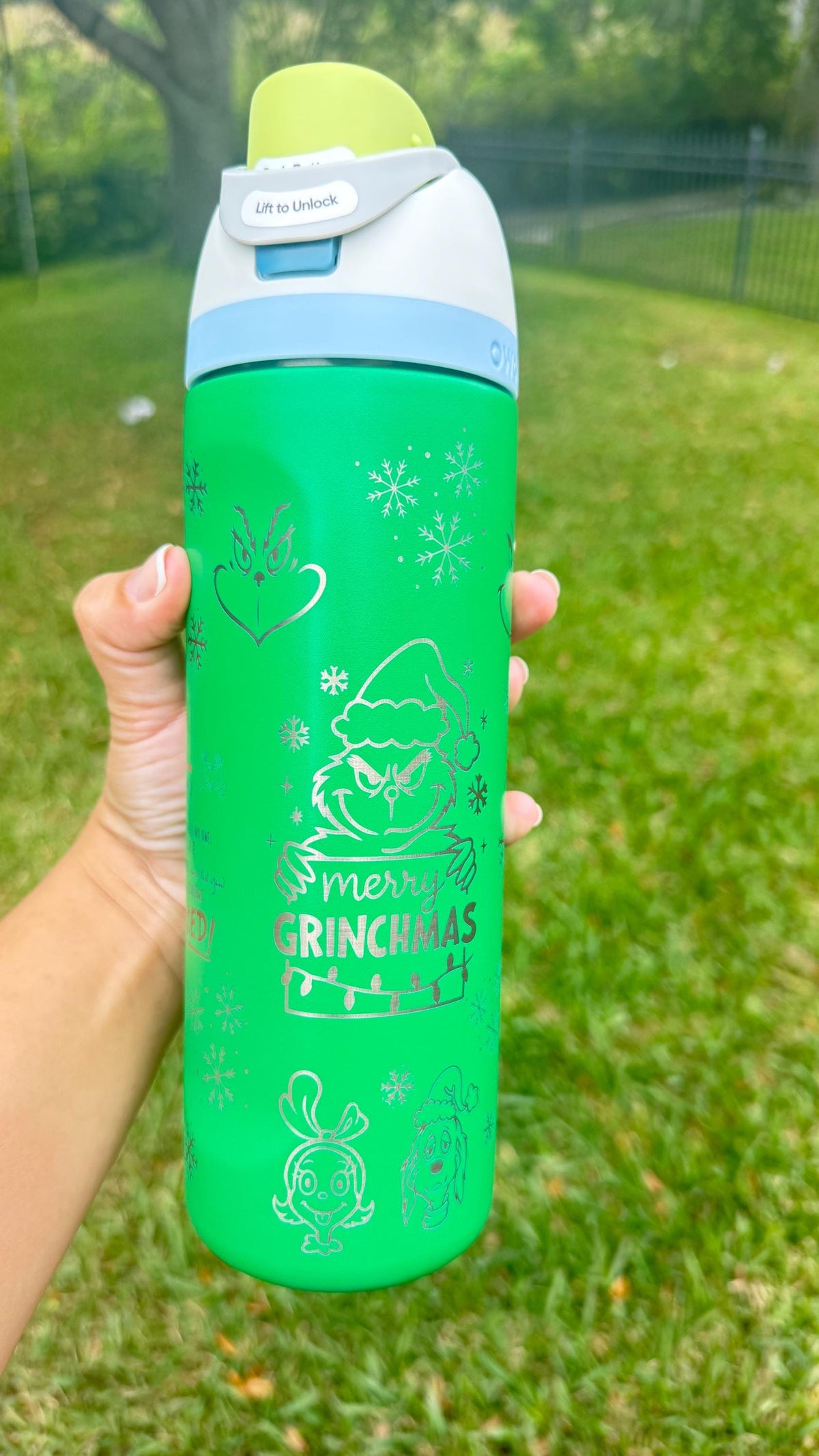 Green engraved Christmas Owala FreeSip with light blue lid
