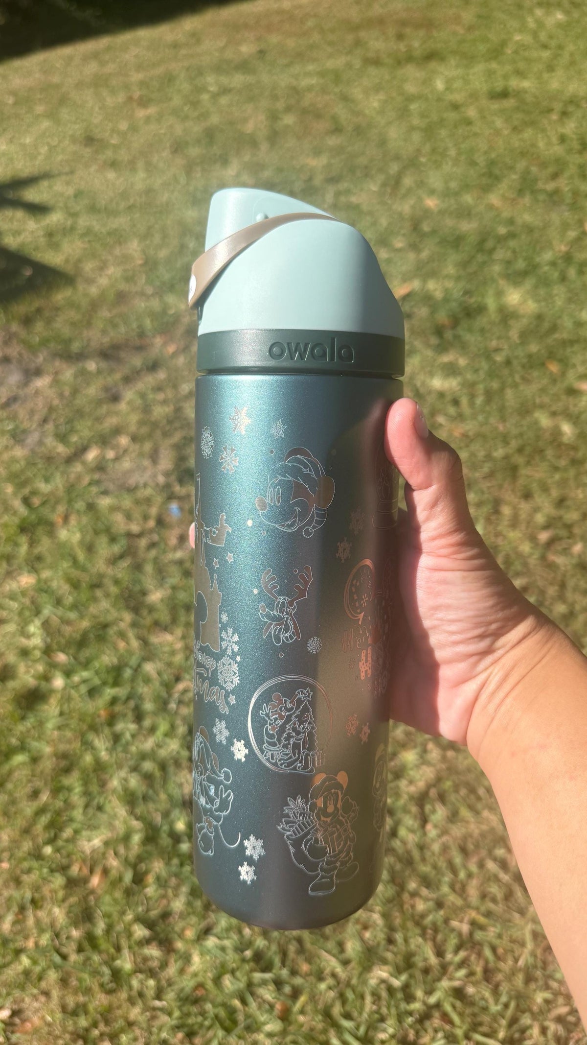 Back of a slate teal Christmas Owala FreeSip