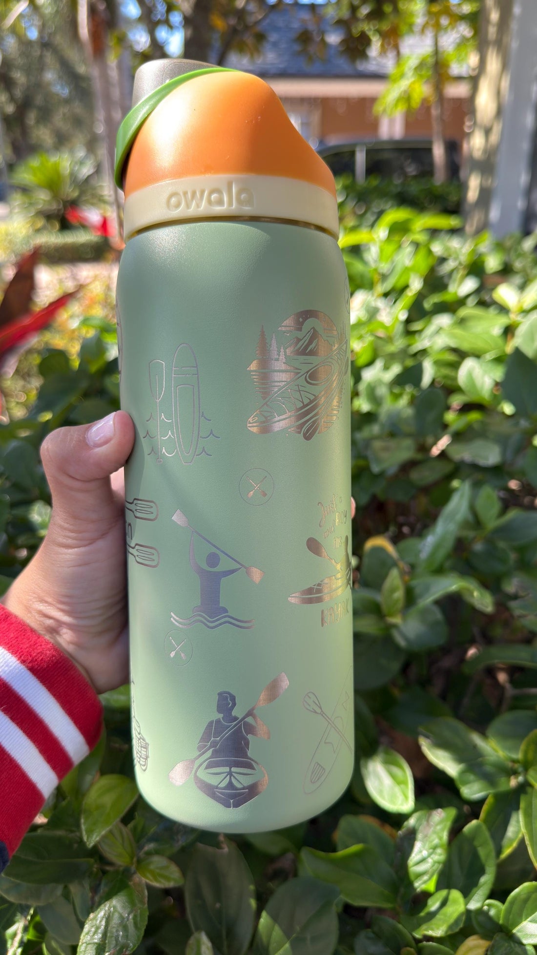 Sage green Owala FreeSip laser engraved with outdoor adventure icons for hiking and kayaking