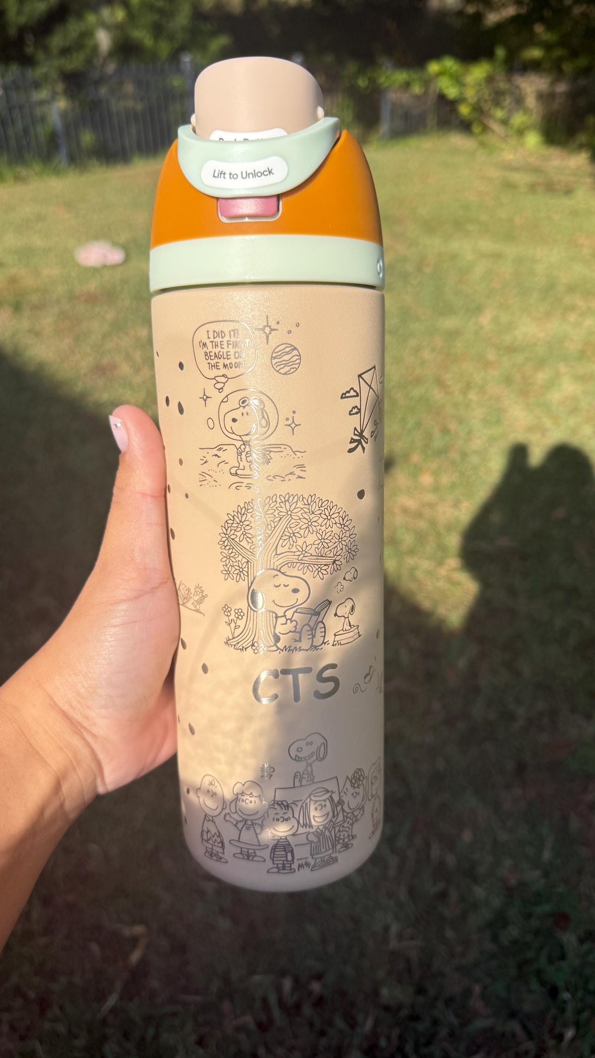Mint green Snoopy engraved Owala shown from the side