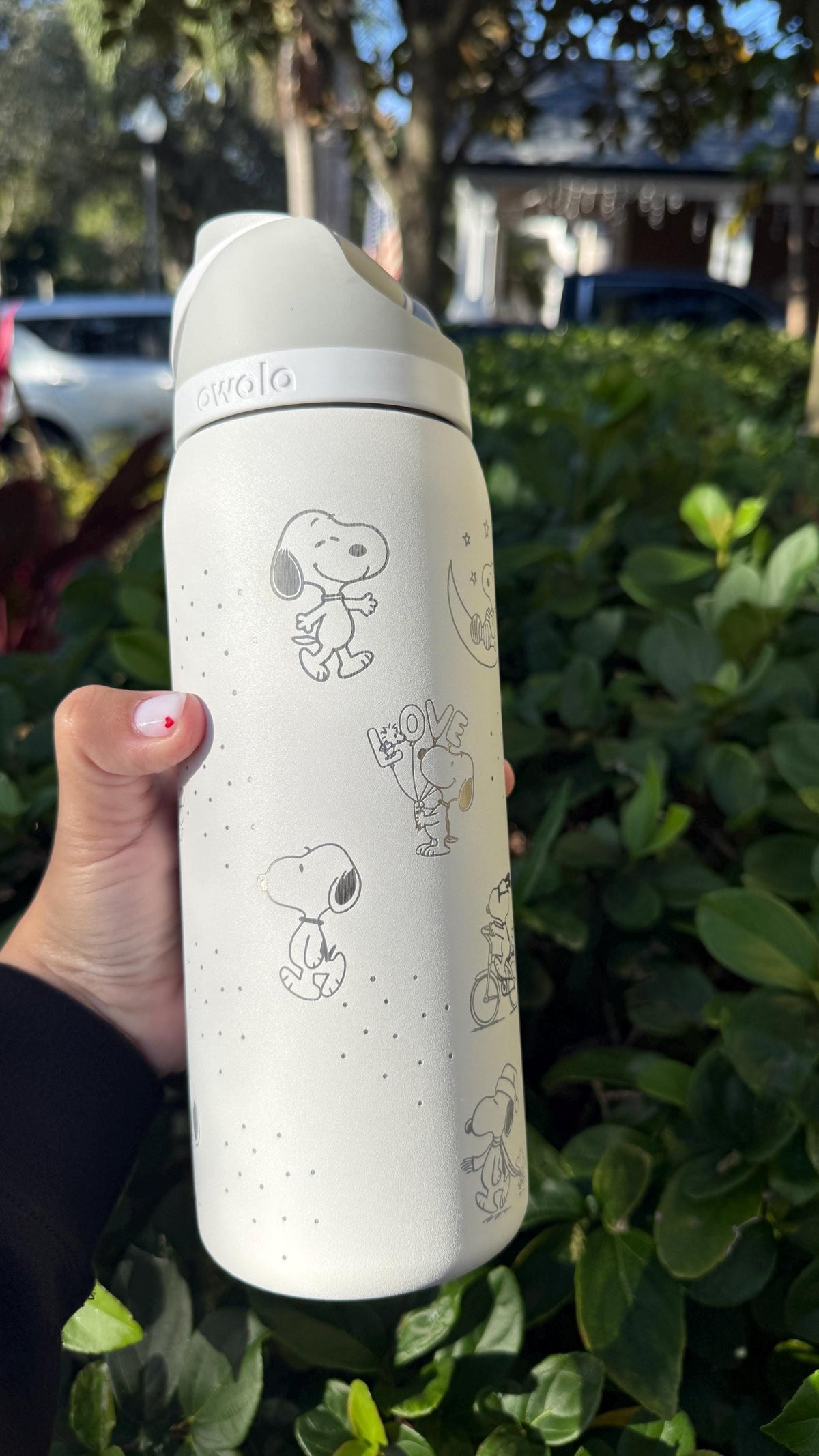 Cream Owala FreeSip laser engraved with minimalist Snoopy and Peanuts characters