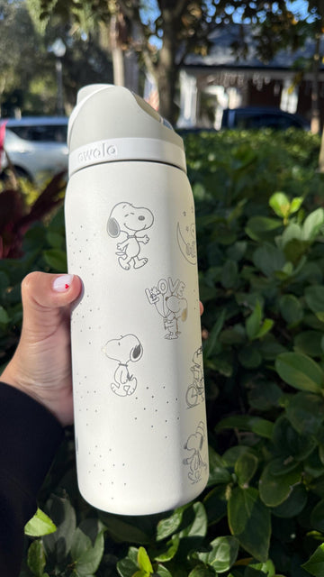 Cream Owala FreeSip laser engraved with minimalist Snoopy and Peanuts characters