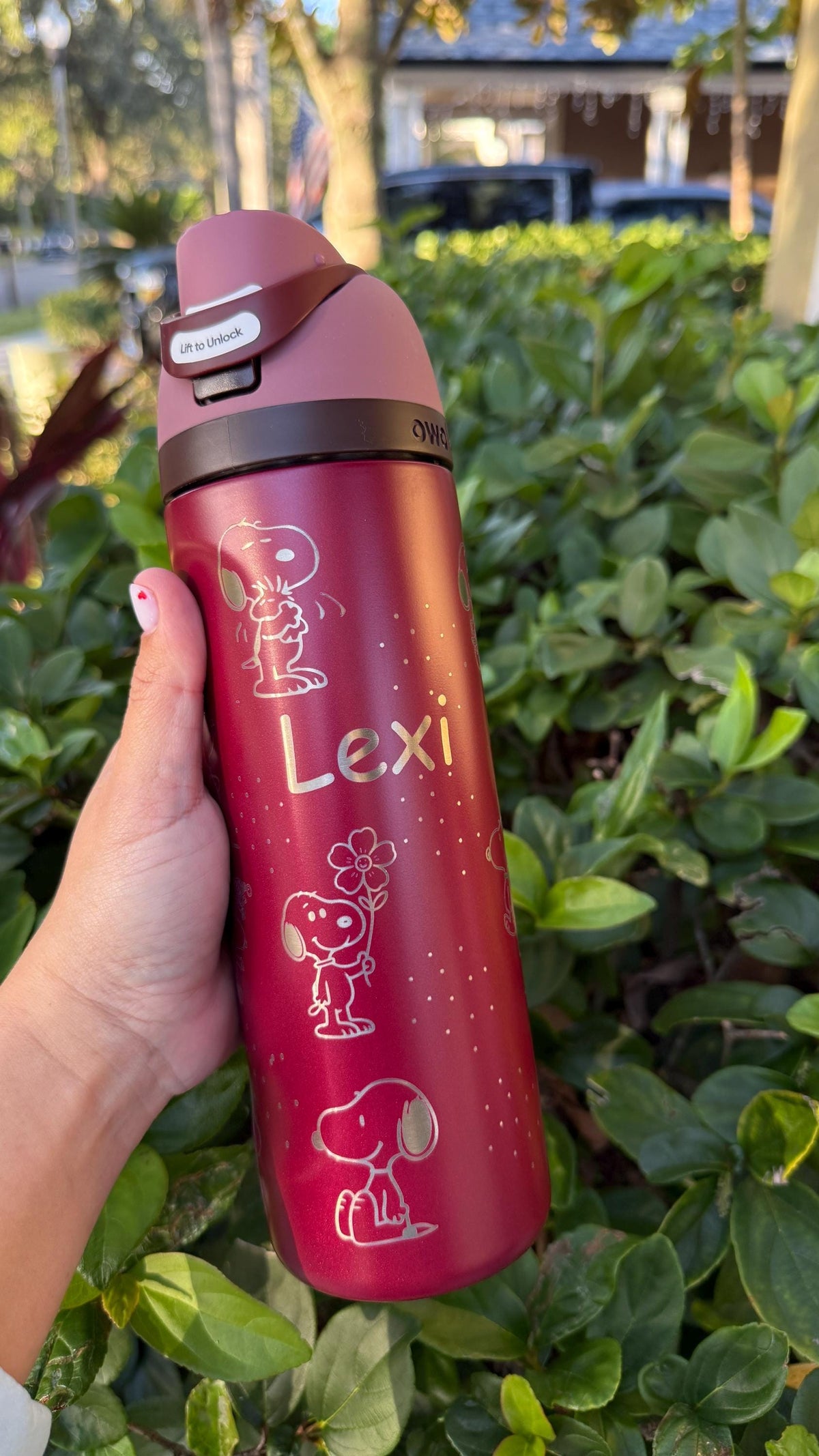 Red Owala FreeSip engraved with Snoopy and the name Lexi