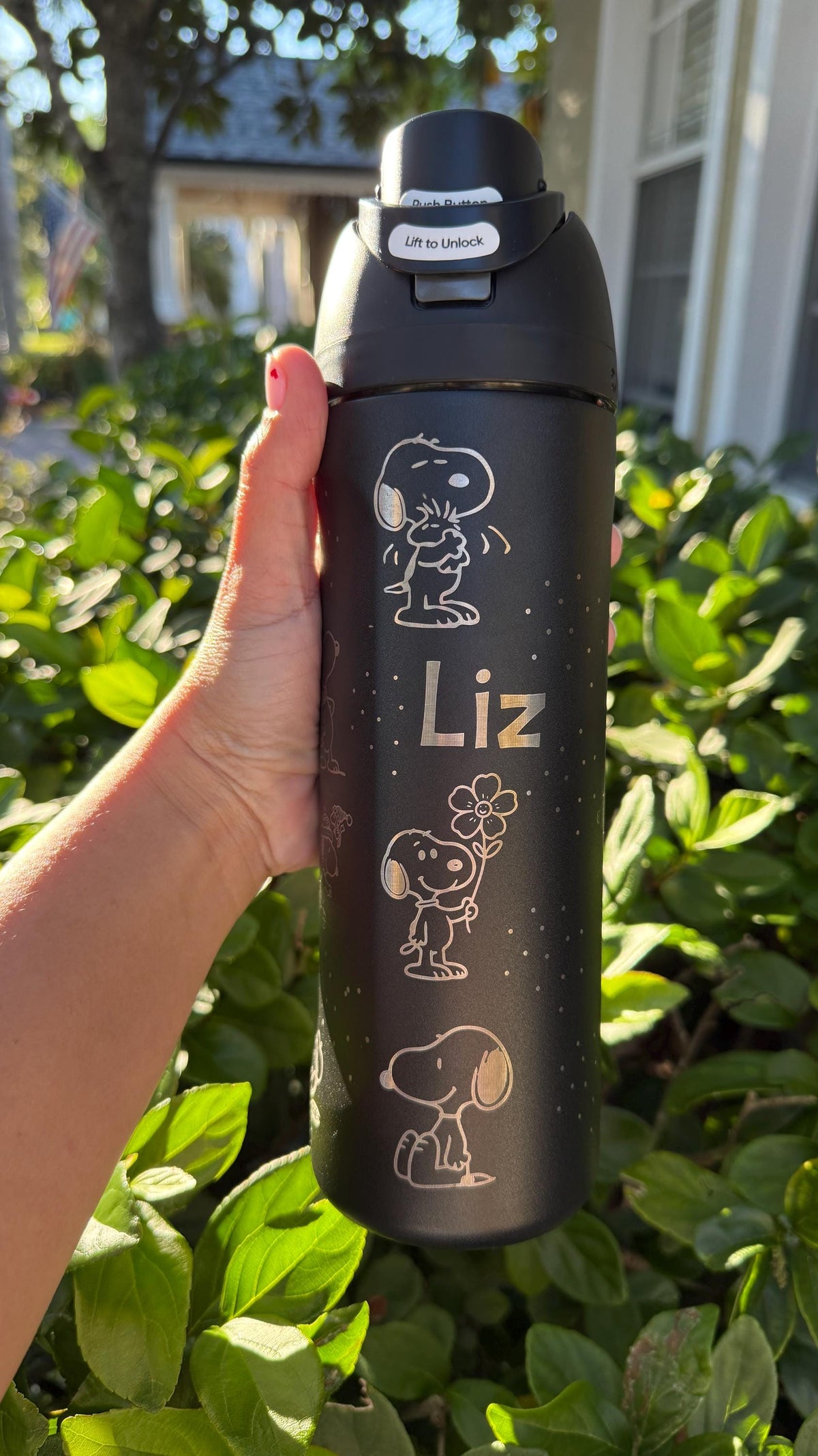 Black Owala FreeSip engraved with Snoopy and the name Liz