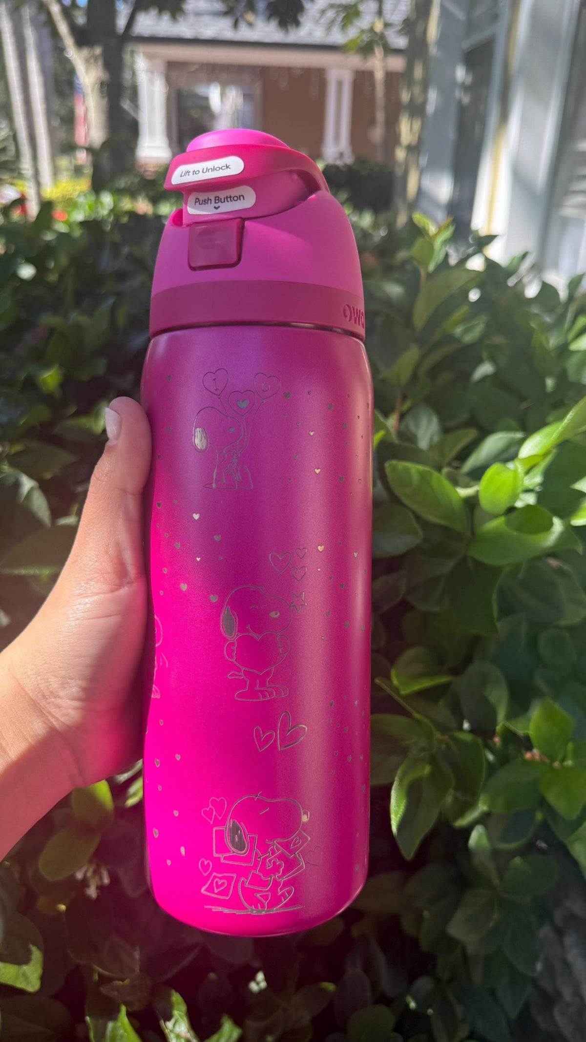 Side view of a pink engraved Snoopy Valentine's Owala