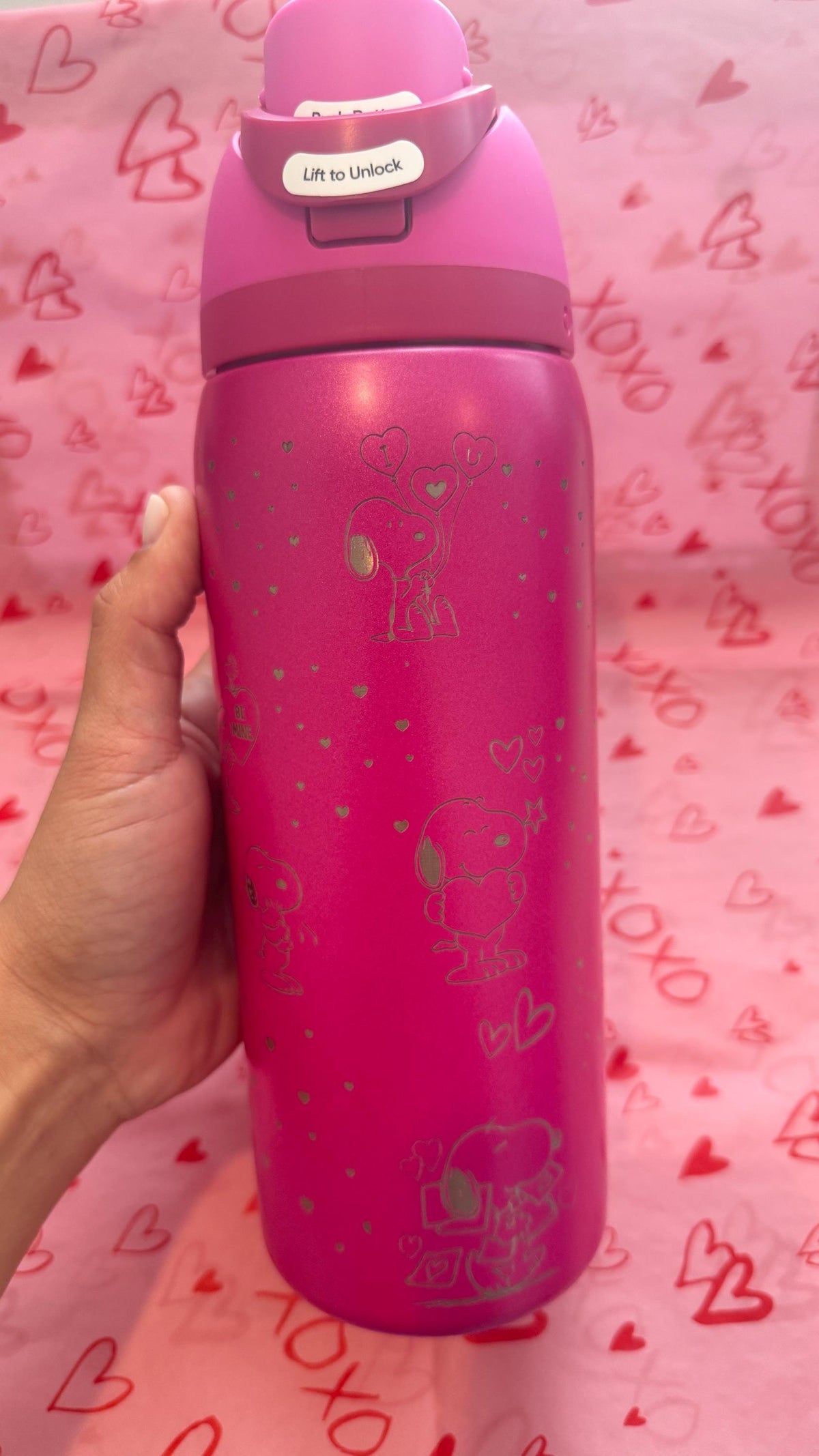 Pink Snoopy Valentine's Owala on a heart-print background