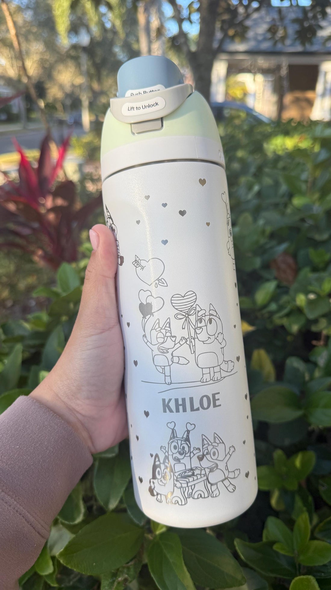 White Owala FreeSip laser engraved with a Bluey-inspired Valentine's design and the name Khloe