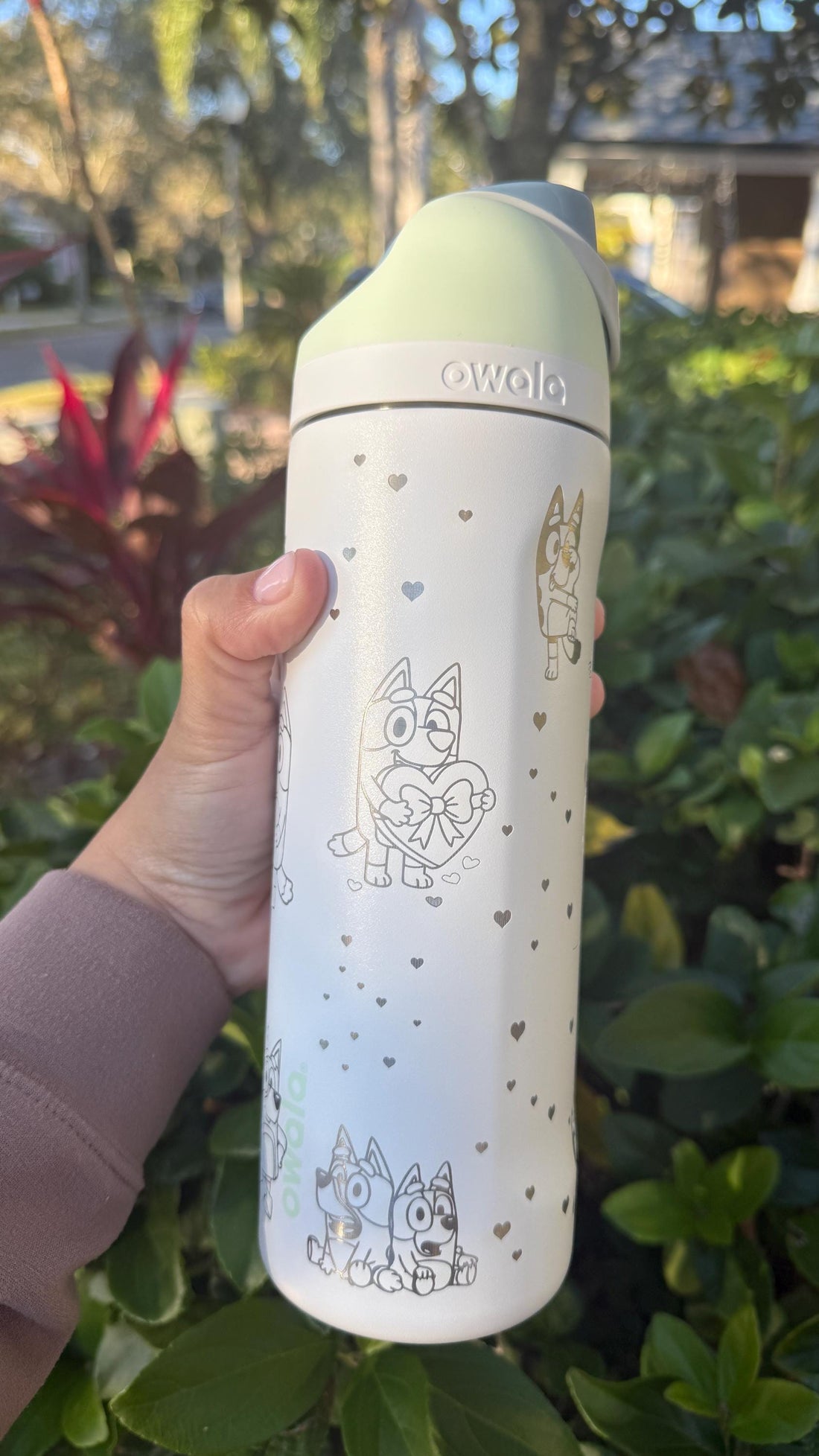 White Owala FreeSip laser engraved with a Bluey-inspired Valentine's design and the name Khloe