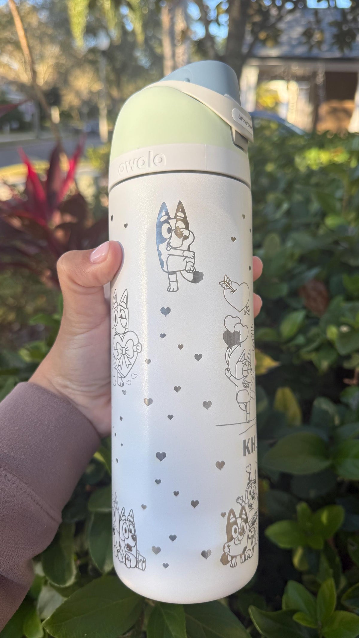 White Owala FreeSip with Bluey-inspired heart engraving