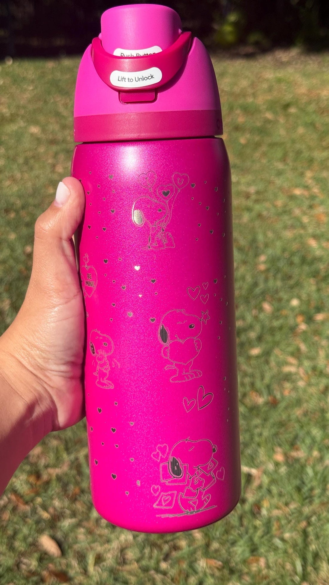 White Owala FreeSip laser engraved with a Snoopy Valentine's Day design