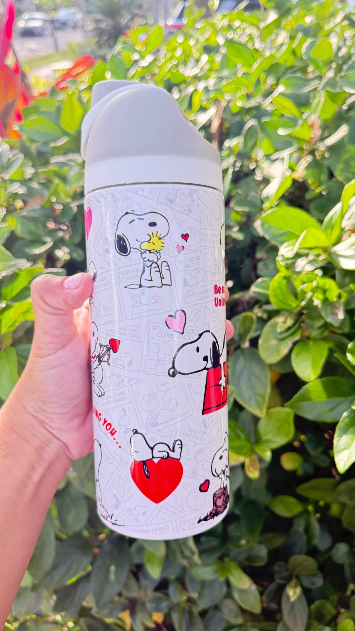 Snoopy and Woodstock Valentine's artwork on a white tumbler