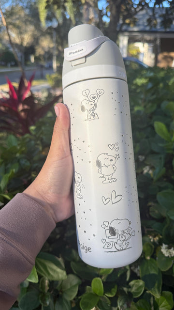 White Owala FreeSip laser engraved with a Snoopy Valentine's Day design