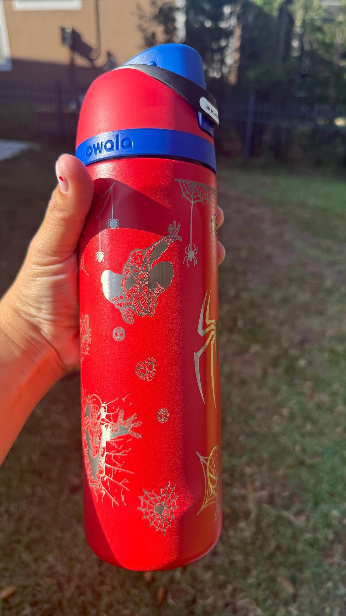 Red engraved Owala FreeSip with Spider-Man and web details