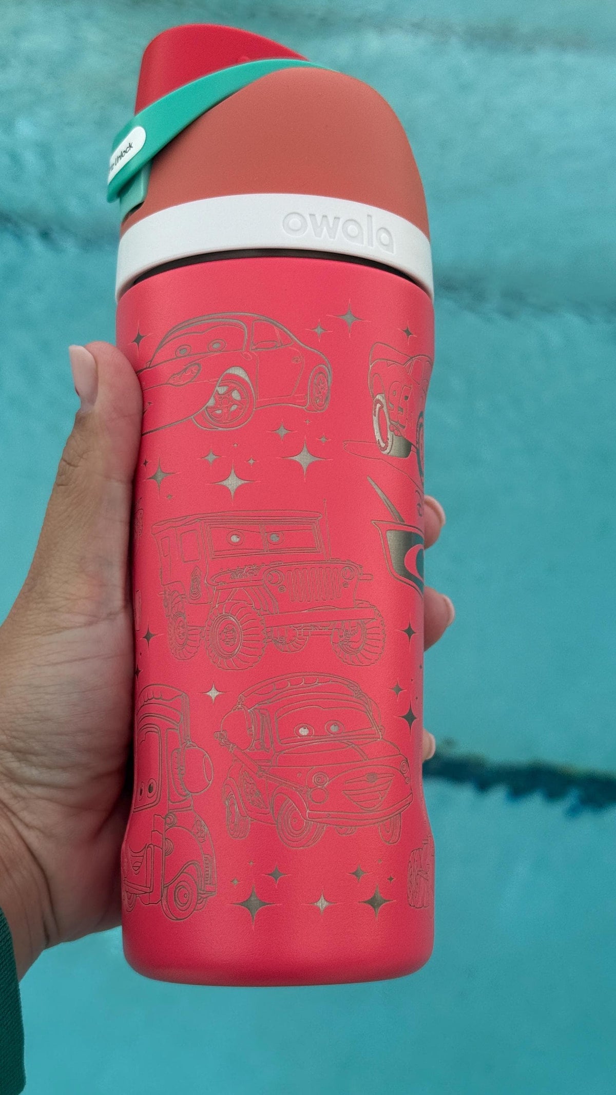 Close-up of Cars-inspired stars and details engraved on a red Owala