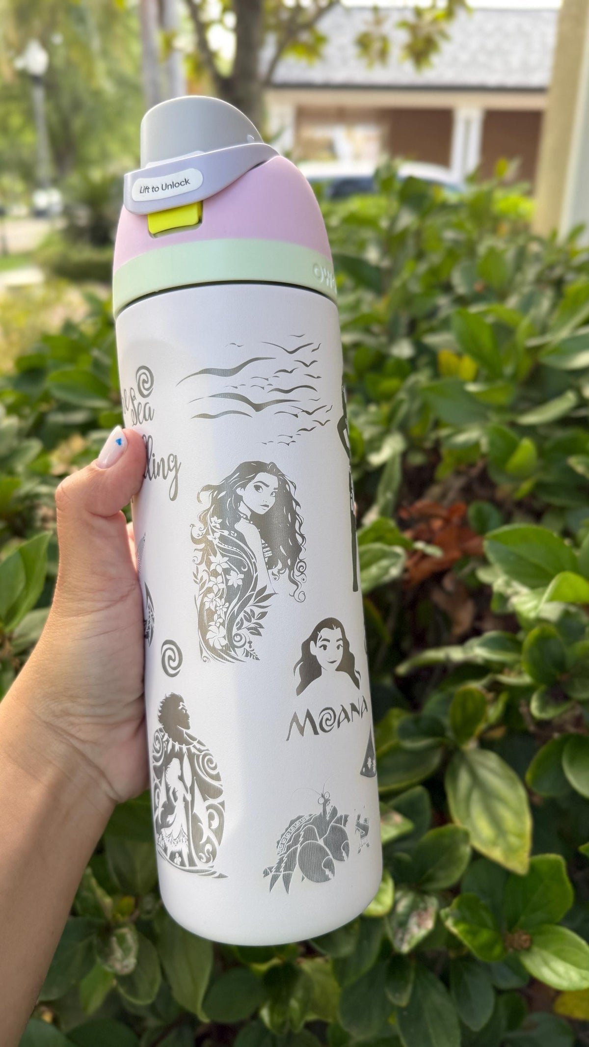 Close-up of Moana-inspired wave engraving on a white Owala FreeSip