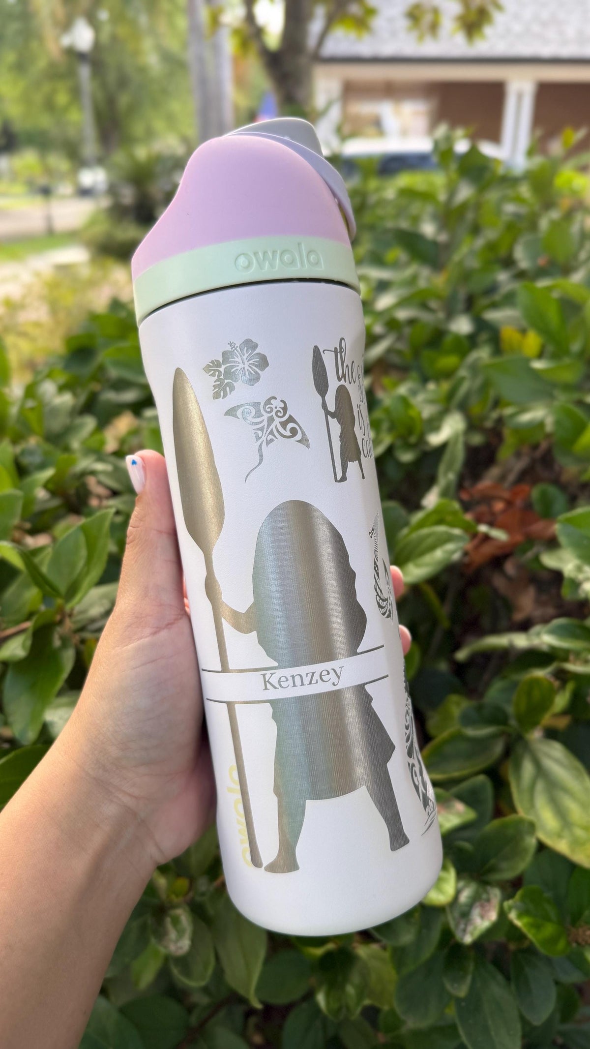 White Owala FreeSip laser engraved with a Moana-inspired ocean design and a name