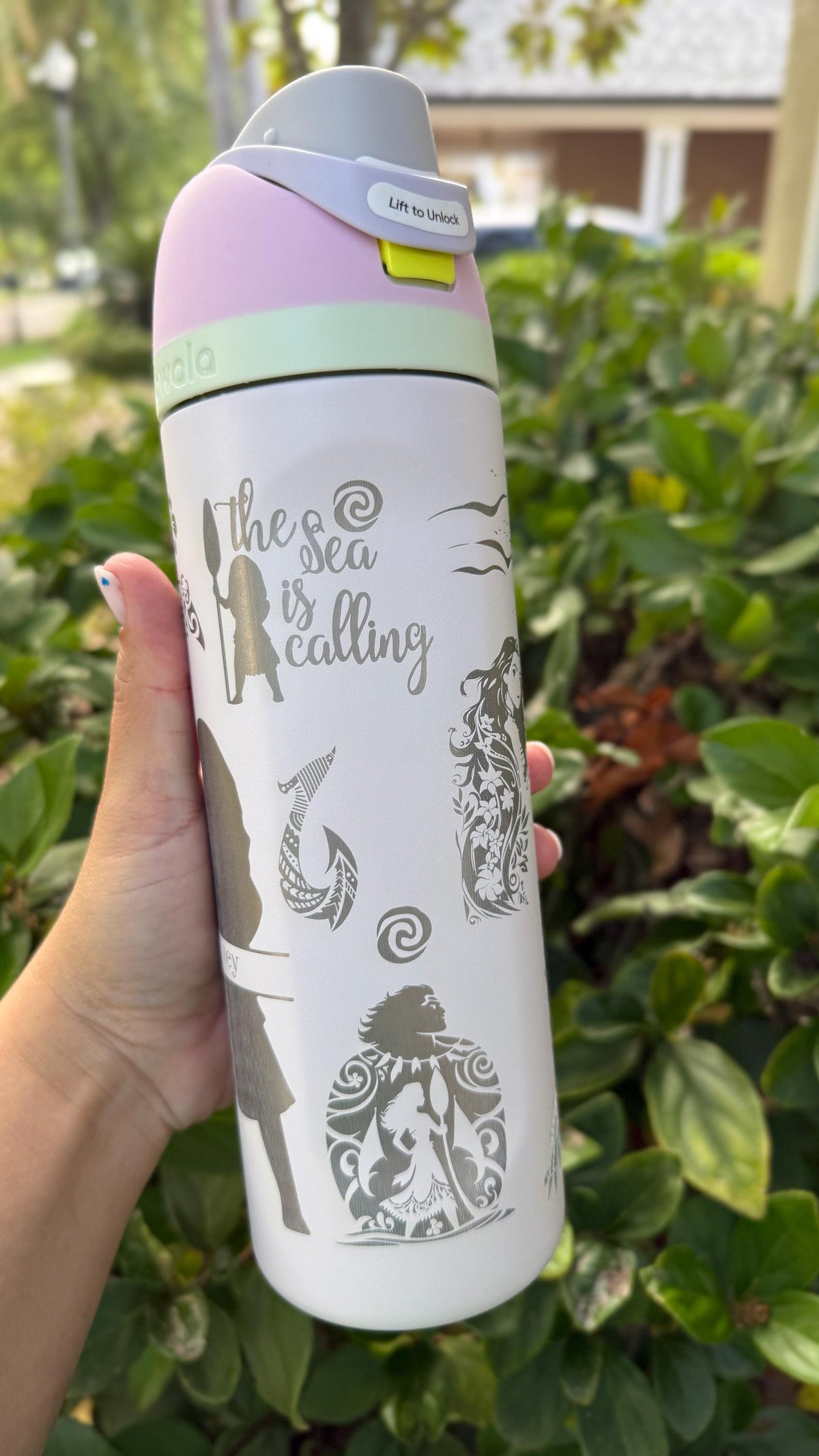 Engraved 'the sea is calling' quote and fish hook on a white Owala