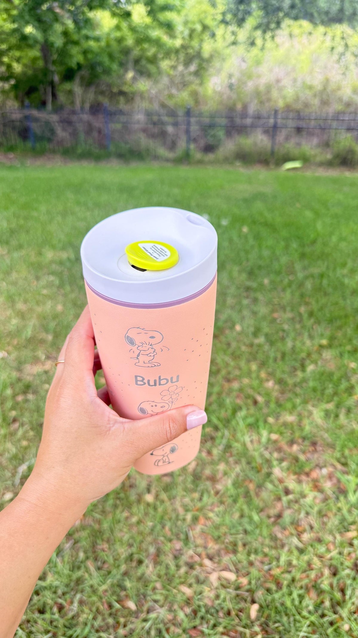 Owala SmoothSip lid and engraved pink tumbler shown from above
