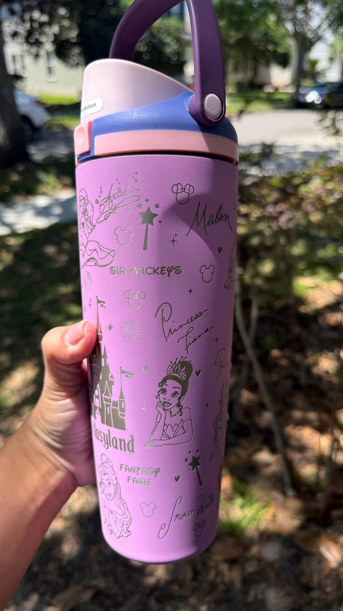 Lilac Owala FreeSip Sway tumbler laser engraved with a Fantasyland castle design