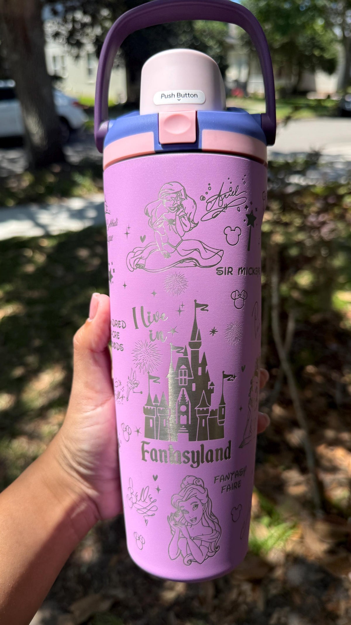 Lilac Owala FreeSip Sway tumbler laser engraved with a Fantasyland castle design