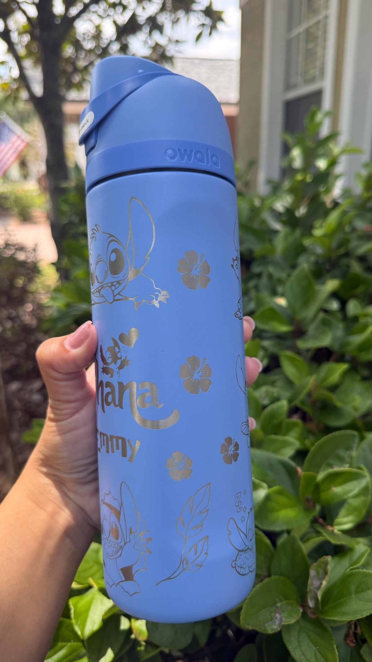 Close-up of the Ohana and name engraving on a blue Owala FreeSip