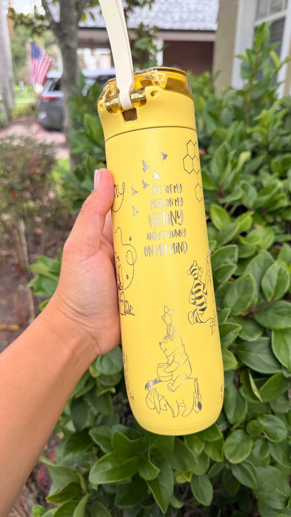 Yellow Stanley FlowState 20 oz tumbler laser engraved with a Winnie the Pooh-inspired design