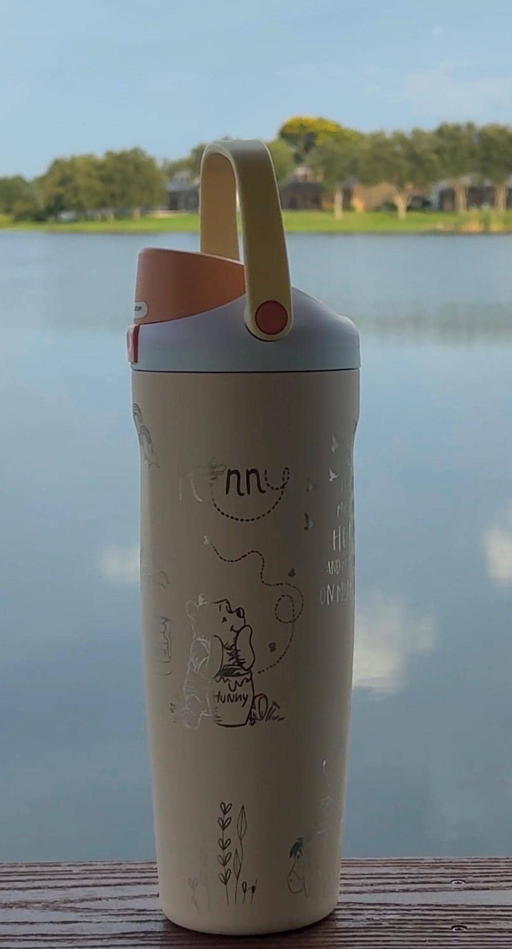 Cream Owala FreeSip Sway 30 oz tumbler laser engraved with a Winnie the Pooh-inspired design