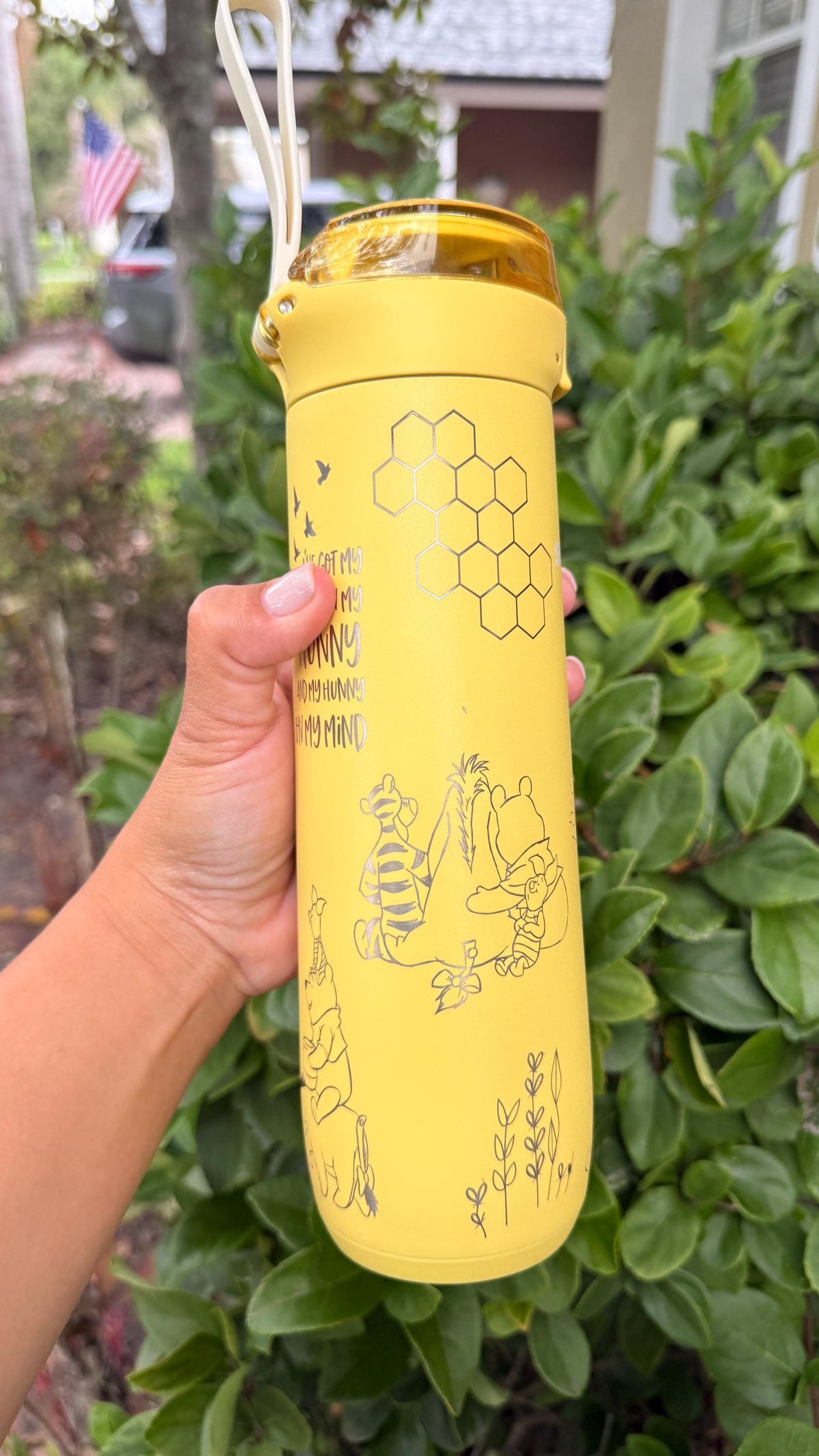 Honeycomb and Pooh engraving on a yellow Stanley FlowState