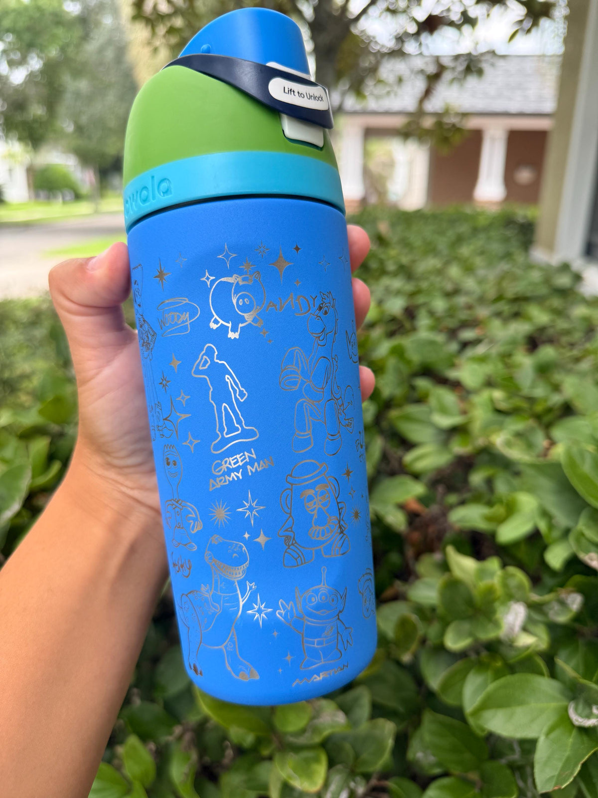 Close-up of Toy Story-inspired engraving on a blue Owala water bottle