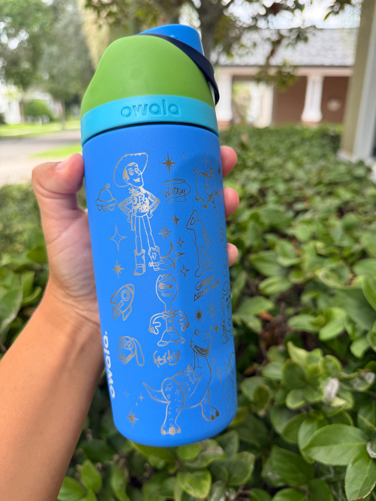 Back of a blue Owala showing more Toy Story-inspired engraving