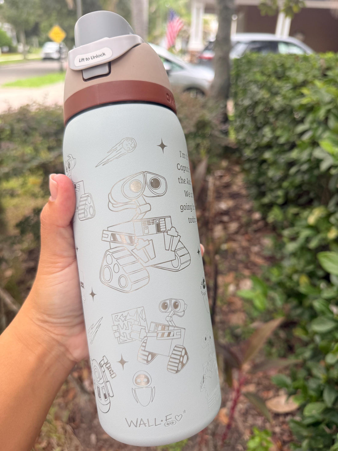 Light blue Owala FreeSip laser engraved with a WALL-E-inspired design
