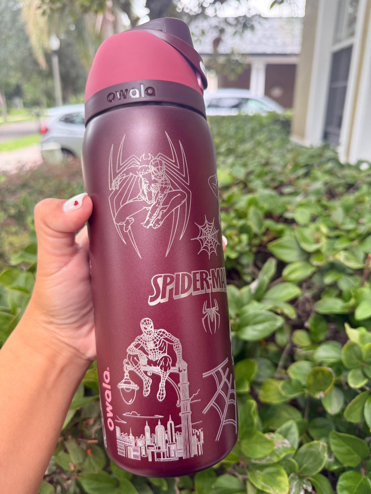 Side view of a Spider-Man laser engraved Owala bottle
