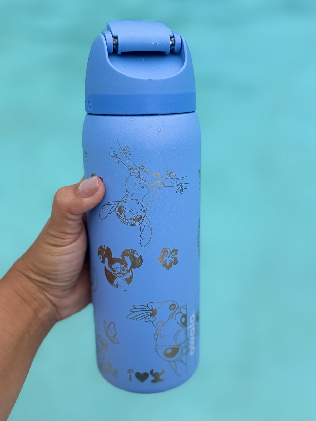 Side view of a blue Owala with engraved Stitch artwork